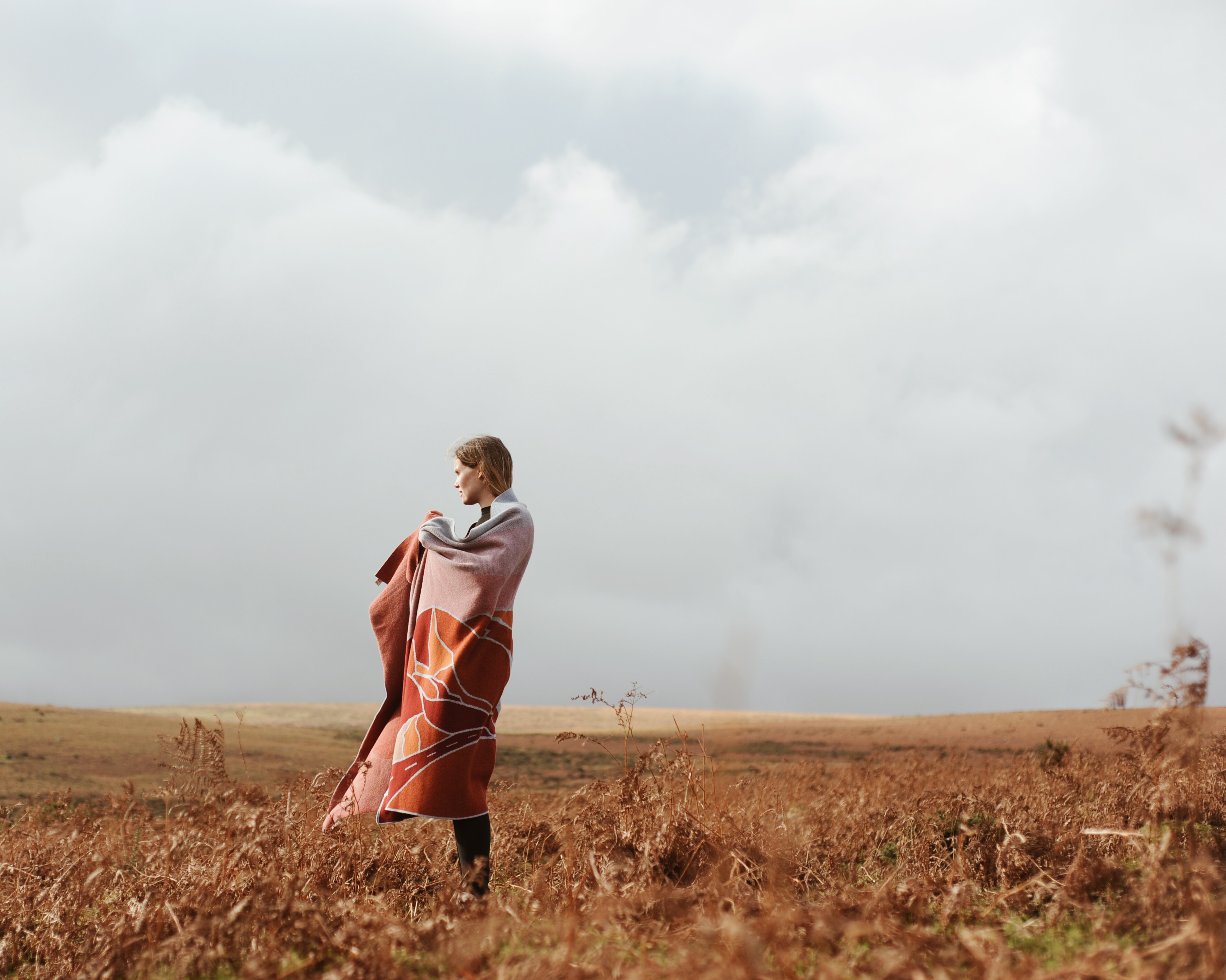 Cath Brown of Feldspar Studio wearing a Feldspar Blanket over her shoulders